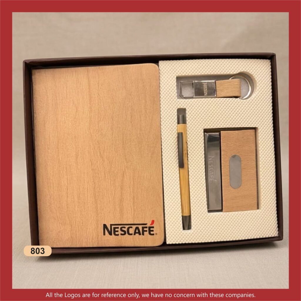 Premium 4-in-1 corporate gift set featuring a notebook, metal pen, keychain and cardholder, presented in an elegant gift box.